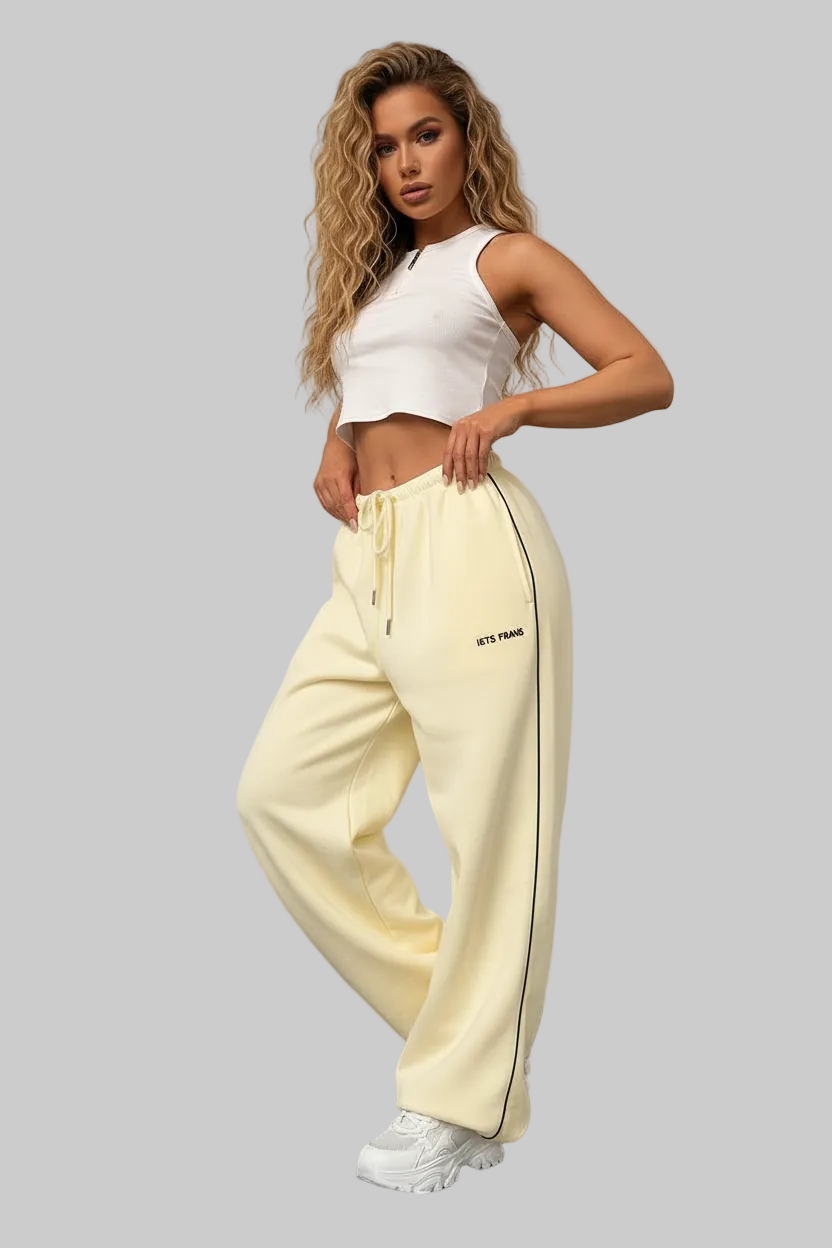 Confident female hip-hop dancer wearing stylish cargo pants and fitted top, neon pink and purple studio lighting, bold attitude, urban queen vibe